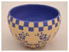 A Bali stoneware geometric design pot, decorated in one medium blue colour on natural background - first view.