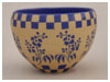 A Bali stoneware geometric design pot, decorated in one medium blue colour on natural background - third view.