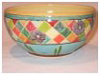 A Bali stoneware bowl, decorated with geometric pattern with flowers in pastel colours - third view.
