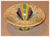 A Bali stoneware bowl, decorated with geometric design and used crystal glaze for background that created random patterns - first view.