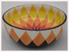 A Bali stoneware wide bowl, decorated with geometric sunflower design in vibrant colours - first view.