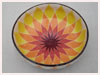 A Bali stoneware wide bowl, decorated with geometric sunflower design in vibrant colours - second view.