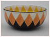 A Bali stoneware wide bowl, decorated with geometric sunflower design in vibrant colours - third view.