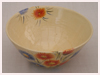 A Bali stoneware bowl decorated with blue and orange garden flowers - second view.