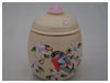 A Bali stoneware bullfinch jar with lid, decorated with bullfich and spring blossom - second view.