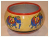 A Bali stoneware round shape pot, decorated with colourful Indian elephants - first view.