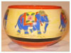 A Bali stoneware round shape pot, decorated with colourful Indian elephants - third view.