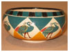 A Bali stoneware small bowl, decorated with peacocks in diamond shapes  - first view.